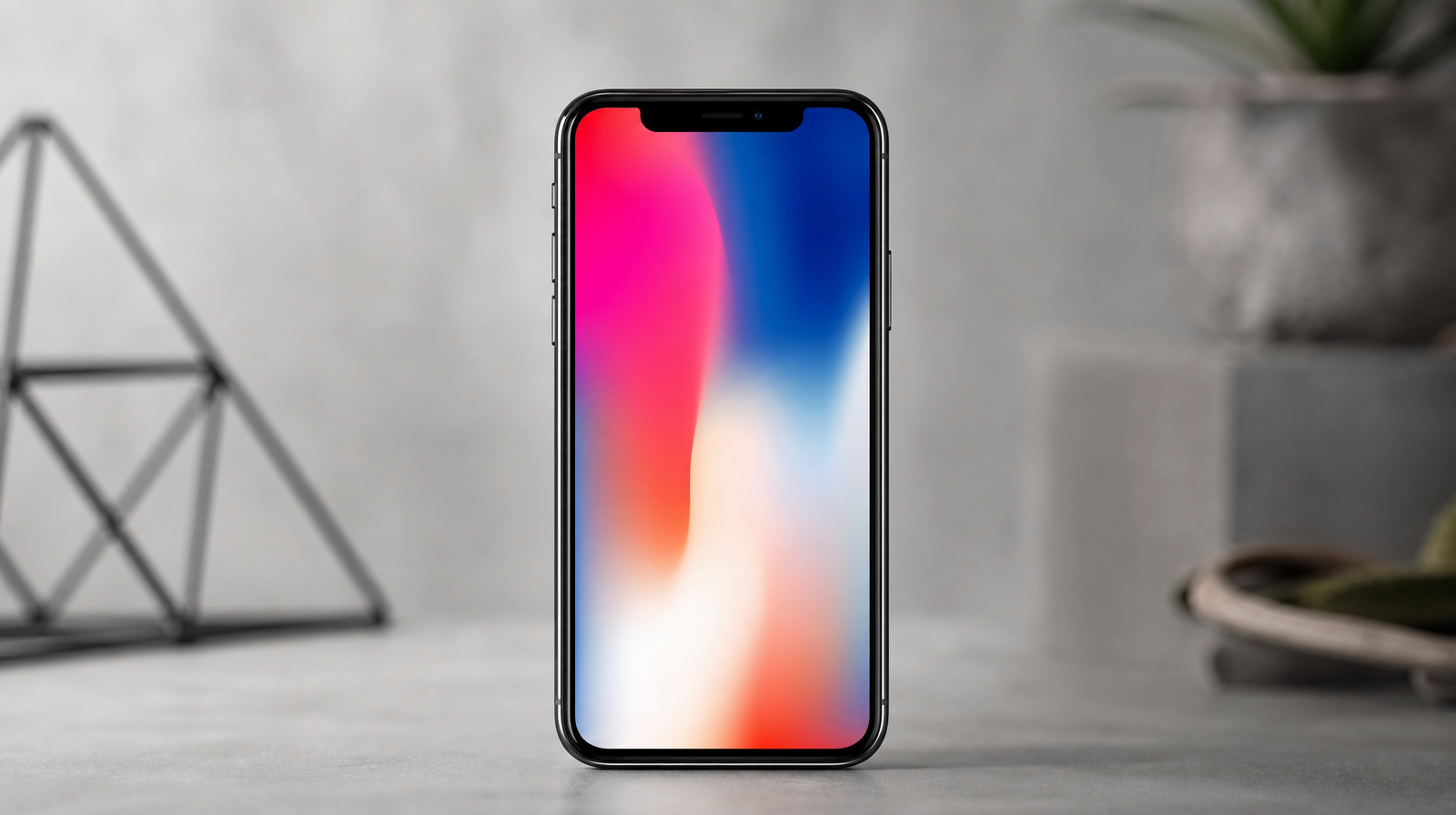 iPhone X ve vesmírně šedé barvě na studiovém pozadí